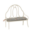 A charming Maileg vintage-style metal bench in off white, featuring a delicate blue floral-patterned cushion tied to the back poles.