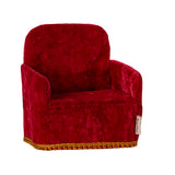A charming Maileg folding chair in a bold red colour, shown from the side. Perfectly sized for Maileg mice and miniature settings.