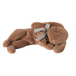 Maileg sleeping bunny plush in soft brown, lying on its side with a floral-patterned bow around its neck.