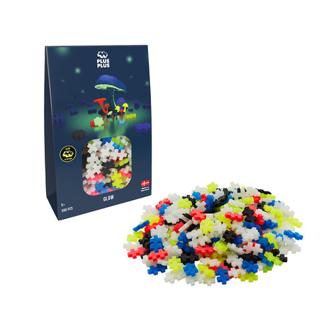 Glow Mix 300 piece Plus-Plus set with packaging and scattered Plus-Plus pieces.