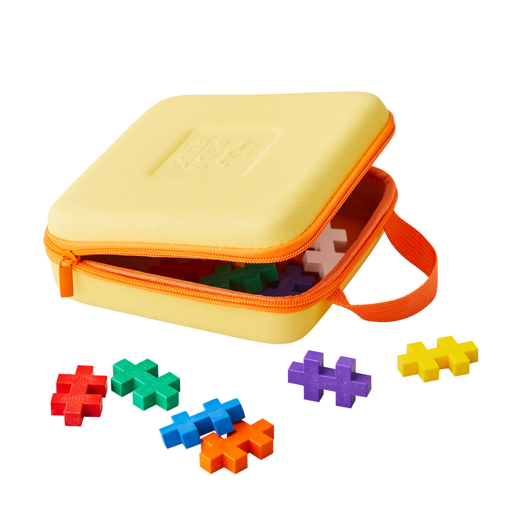 A Plus-Plus travel case slightly unzipped, revealing vibrant Plus-Plus BIG pieces spilling out.