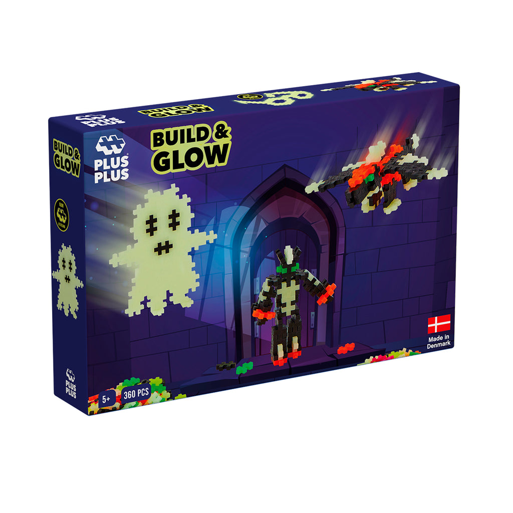 Plus-Plus Build & Glow 360-piece set in packaging featuring glow-in-the-dark ghost, robot, and flying creature.
