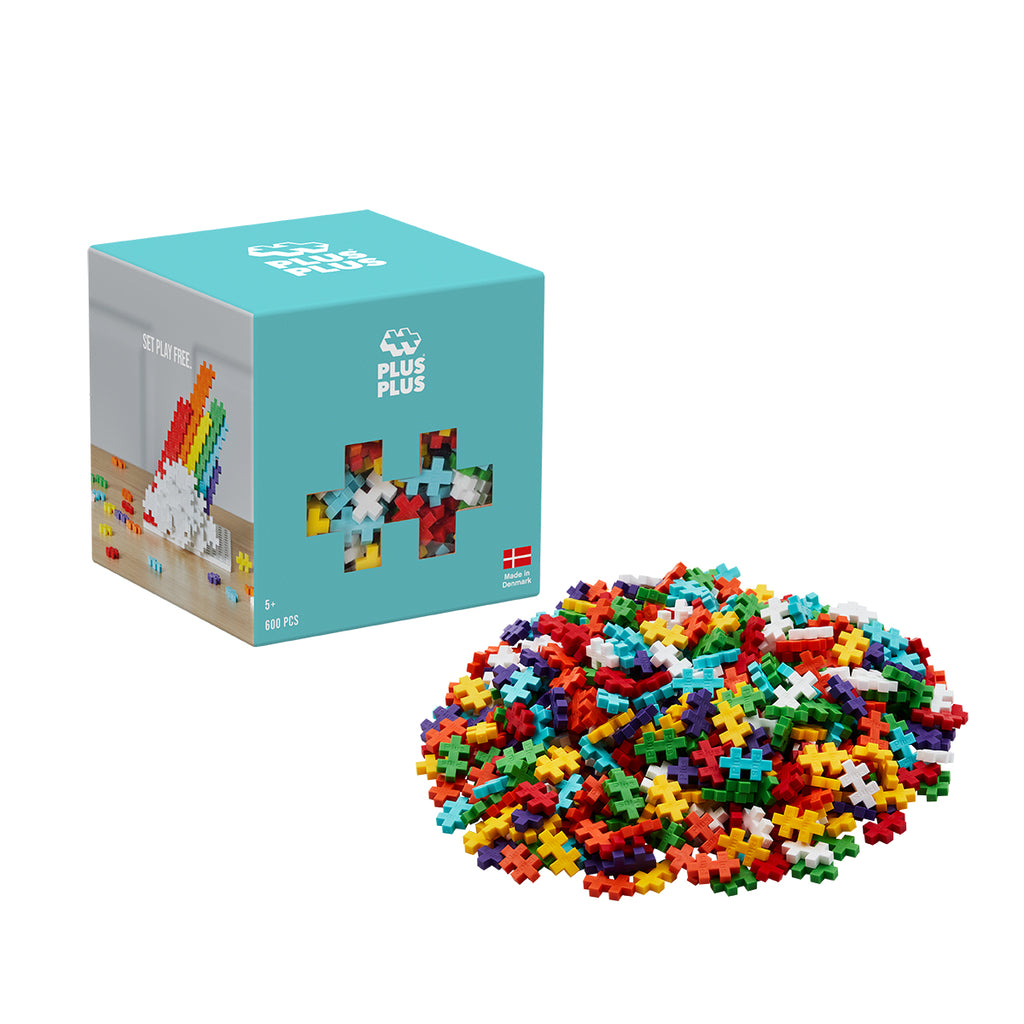 Rainbow Mix packaging alongside a pile of colourful Plus-Plus bricks.