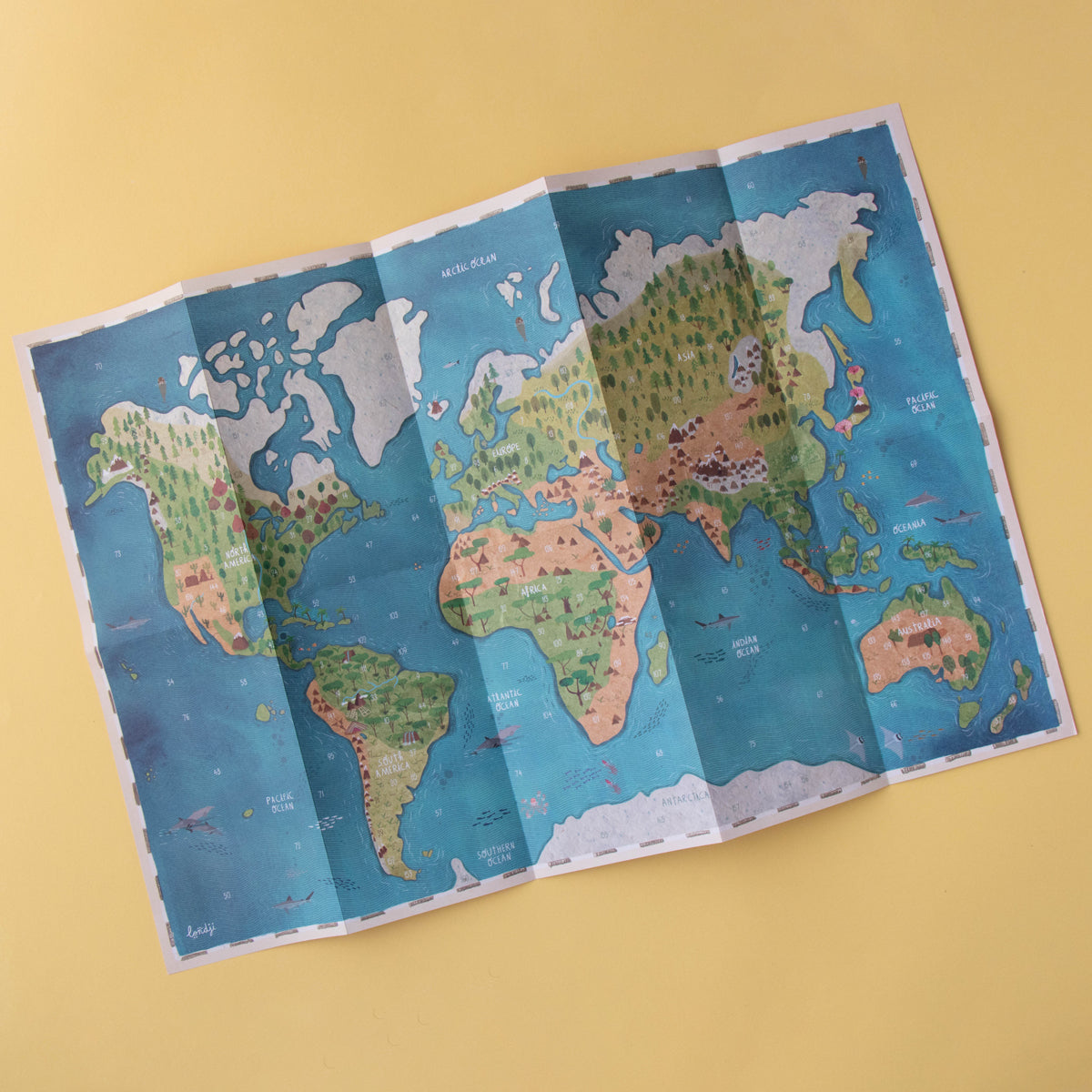 Folded Londji Animal World map poster showcasing different continents and their wildlife.