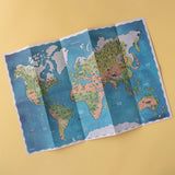 Folded Londji Animal World map poster showcasing different continents and their wildlife.