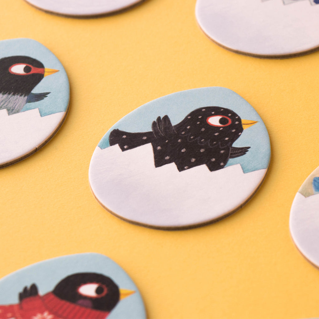 Close-up of a black chick hatching from an egg in the Chicks & Chickens memory game.
