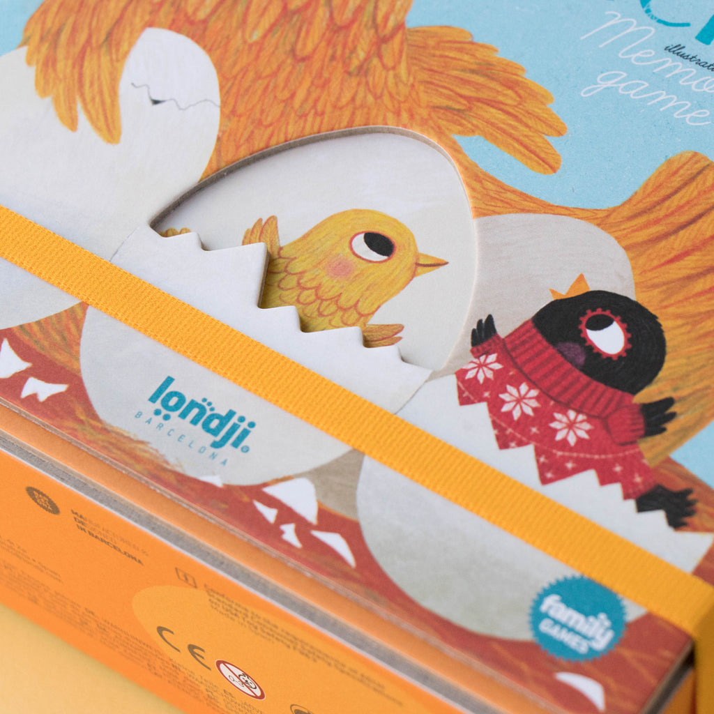 Close-up of Chicks & Chickens memory game box with a yellow chick and a black chick peeking from eggs.