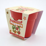 A red bamboo plant pot packaged in a "Grow Your Own Peppers" children's gardening kit cardboard sleeve.