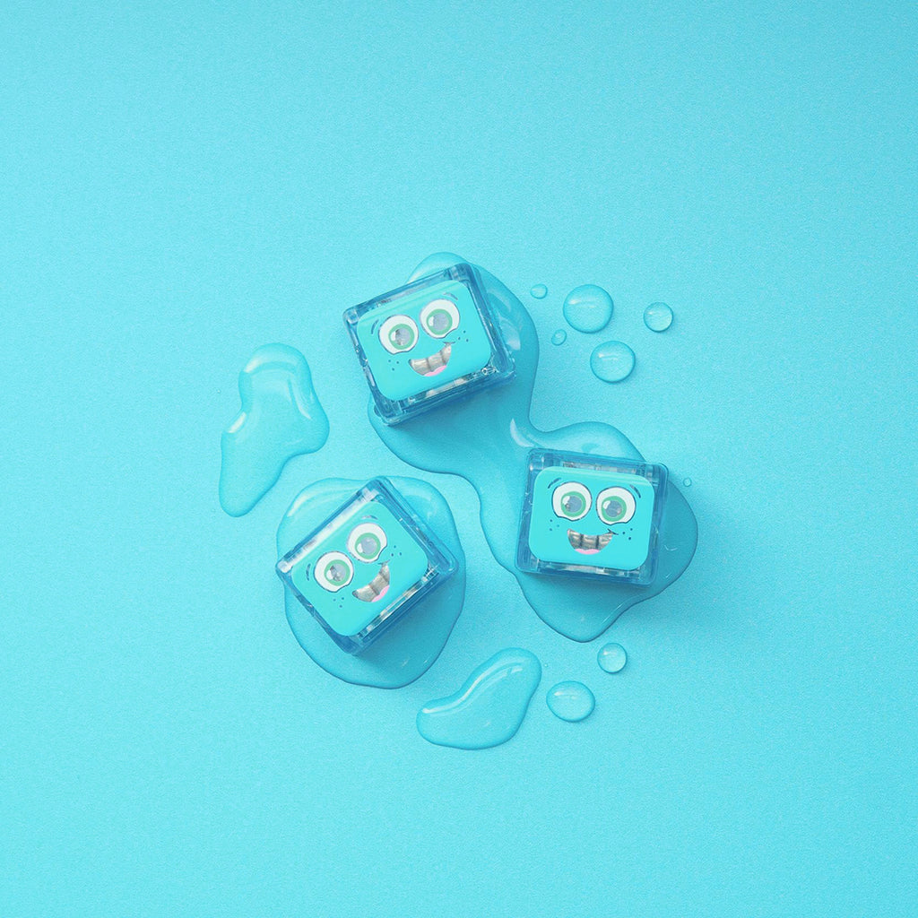 Three blue Blair Glo Pals cubes on a light blue background with water droplets.
