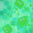Green Pippa Glo Pals light-up sensory cubes floating in water with green decorative elements.