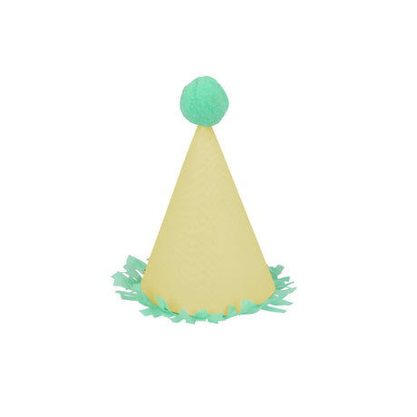 Light yellow mini party hat with mint green pom-pom and fringe trim on white background. Ideal for party decorations.