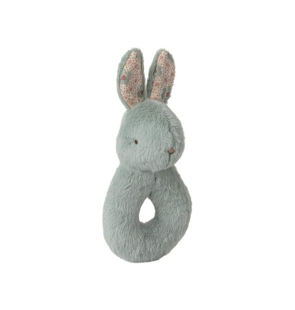 Close-up of the mint Maileg rabbit rattle with soft cotton texture
