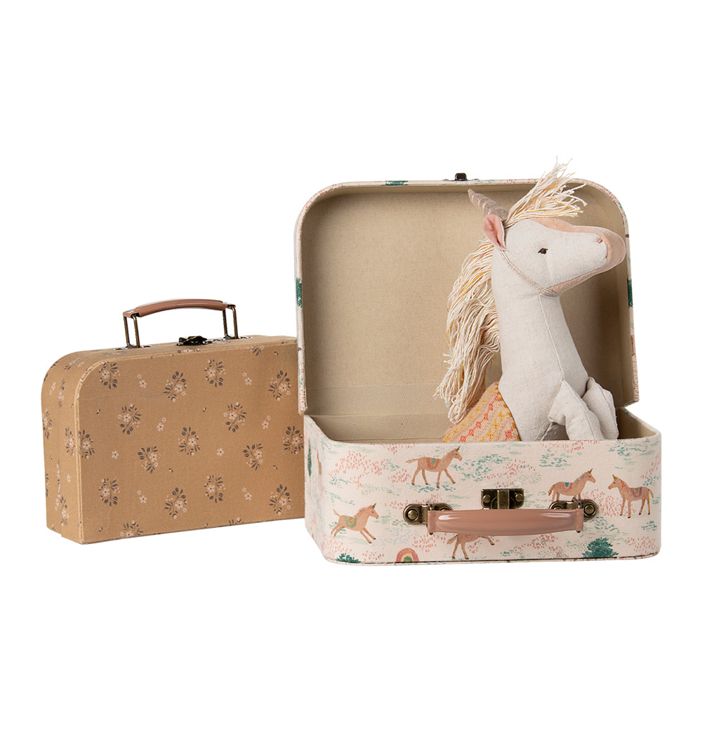 Maileg unicorn suitcase set with soft unicorn toy inside, a whimsical storage solution in the UK.