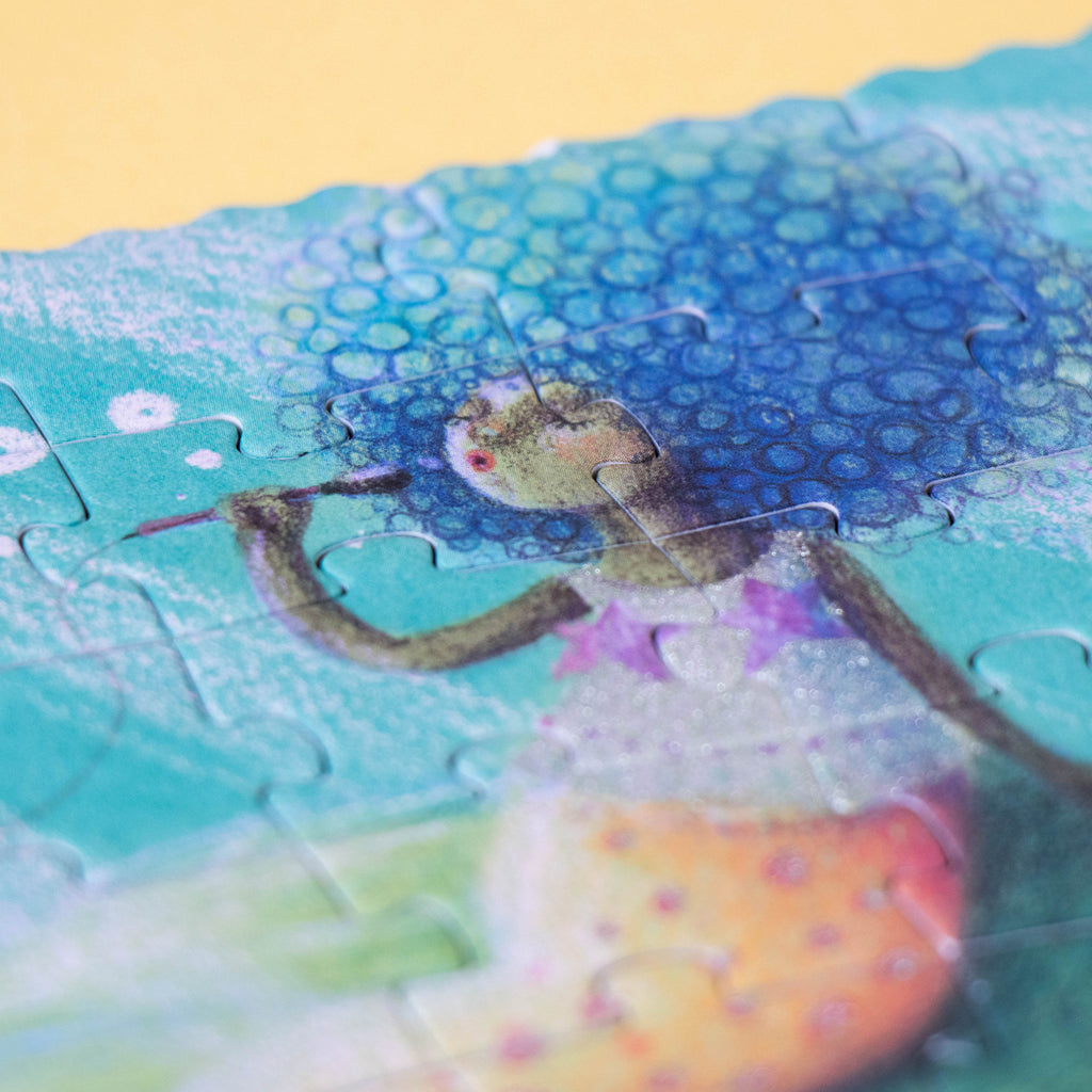 A puzzle section showing a mermaid with a voluminous bubble-like blue hairstyle, playing a flute.