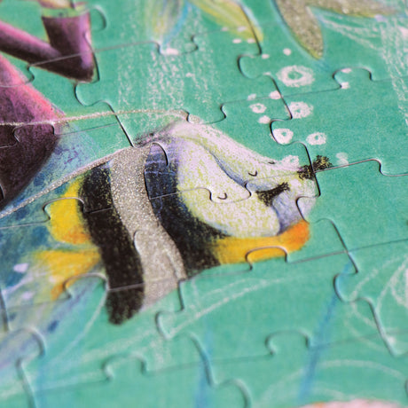 A close-up of a fish illustration from the puzzle with glittery accents.