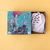 The Londji My Mermaid puzzle box opened to reveal a fabric storage bag with fish illustrations.