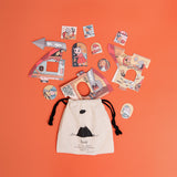 Sweet Dreams puzzle pieces scattered next to a drawstring storage bag