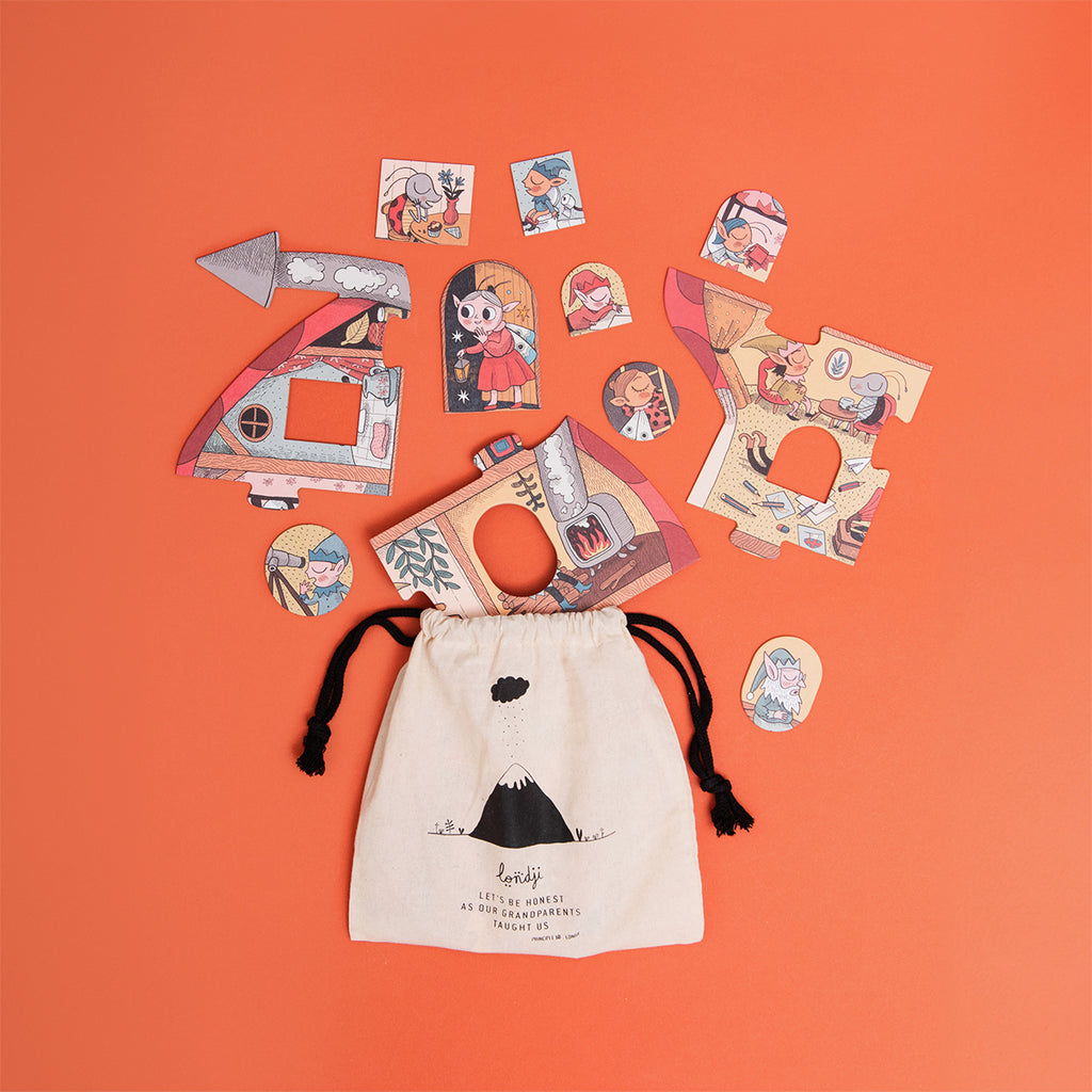 Sweet Dreams puzzle pieces scattered next to a drawstring storage bag