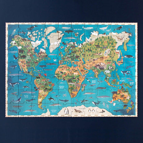 The fully assembled Animal Planet puzzle displaying a world map with animals.