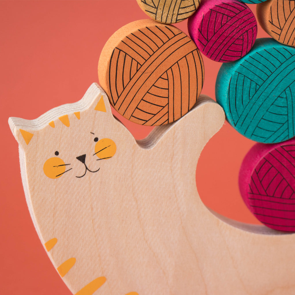 Close-up of the wooden cat figure from the Meow! stacking game