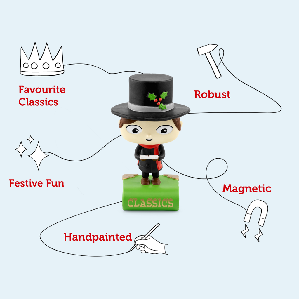 A cheerful figurine of a child in a top hat and red scarf stands on a green book labeled "CLASSICS".