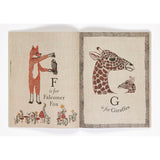 Illustrated alphabet book spread featuring "F is for Falconer Fox" and "G is for Giraffes" on textured pages.
