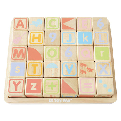 Set of wooden ABC learning blocks with letters, numbers, and illustrations arranged in a tray.