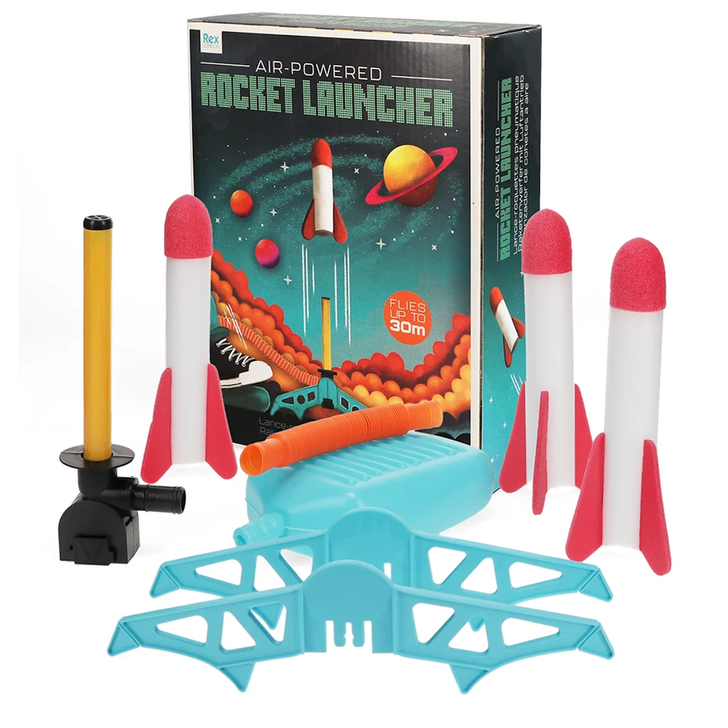 Box set of an air-powered rocket launcher with four red and white foam rockets, a black and yellow pump, and a blue launch pad. Box art shows rockets flying in space.