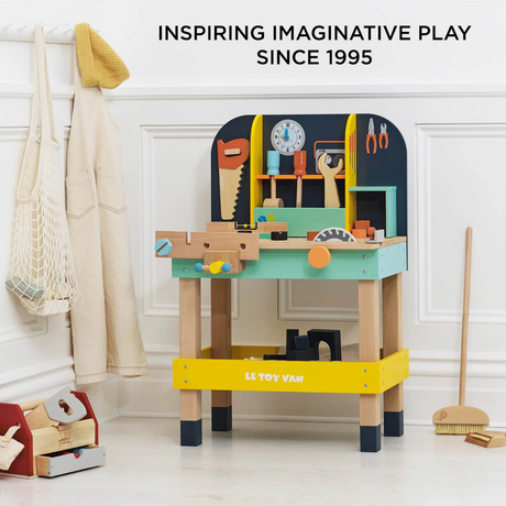 Toy workbench packaging featuring colorful wooden tools. Text reads 'Beautifully Packaged for Gifting' and '100% Recyclable Packaging.'