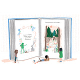 An open book with illustrated pages shows a whimsical forest scene and a quote about storytelling. Three children are engaged, one lying down, two standing. The mood is imaginative and curious.