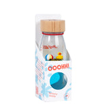 A sensory bottle featuring a small yellow rubber duck and a floating beach ball, packaged and labeled "Ooohh! Sensory Bottle."