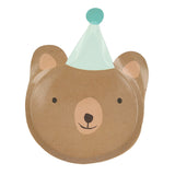 Die-cut paper plate shaped like a smiling brown bear face wearing a mint green party hat with a blue pom-pom.