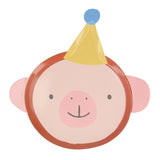 Die-cut paper plate shaped like a smiling monkey face wearing a yellow party hat with a blue pom-pom.