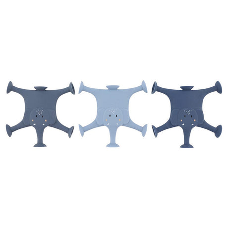 Three silicone elephant-shaped bottle holders are laid flat. They are in dark blue, light blue, and dark gray, each with cute face details.