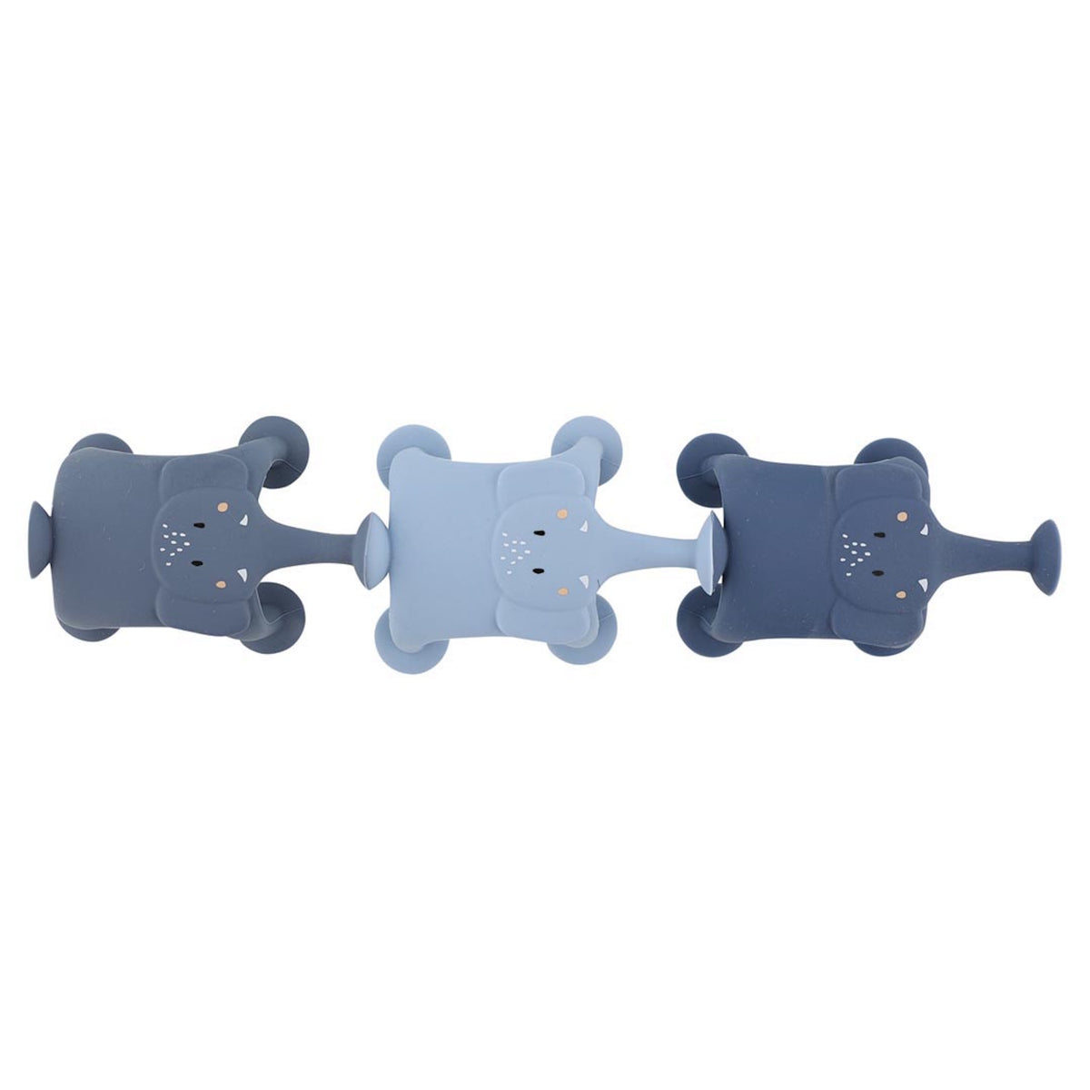 Three toy elephants in shades of blue are lined up horizontally. Each elephant has a rounded body and a cute, smiling face, evoking playful charm.