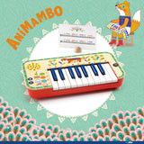 Djeco Animambo electronic synthesizer wooden toy keyboard for kids with sheet music.