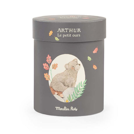 Charcoal grey cylindrical box with an illustration of a bear and text reading "ARTHUR Le petit ours" and "Moulin Roty."