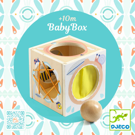 Djeco BabyBox wooden activity toy for toddlers 10 months plus featuring sensory holes and a wooden ball.