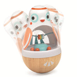 Wobbling wooden bird toy with a rattle for infant sensory play and fine motor skill development.