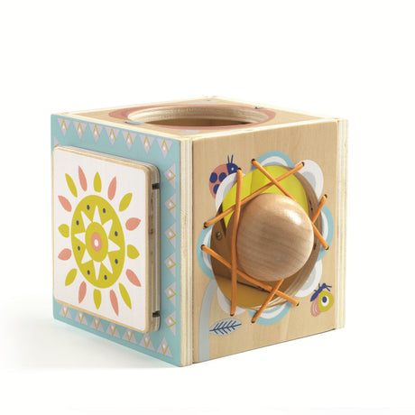 Wooden activity cube for toddlers featuring sensory lacing, sun graphics, and Montessori-style learning play.