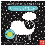 "Baby's First Cloth Book: Cuddly Sheep" cover featuring a black-and-white sheep on a pattern background.