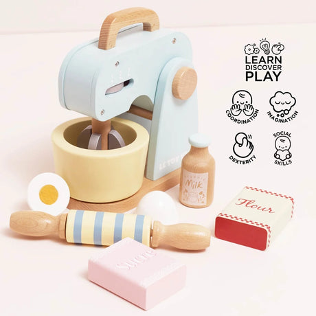 Wooden toy baking set with pastel blue mixer, bowl, rolling pin, milk bottle, egg halves, and flour/sugar boxes.