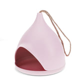 Pink teardrop-shaped bamboo fiber bird feeder with a jute hanging rope and wide front opening for bird seed access.