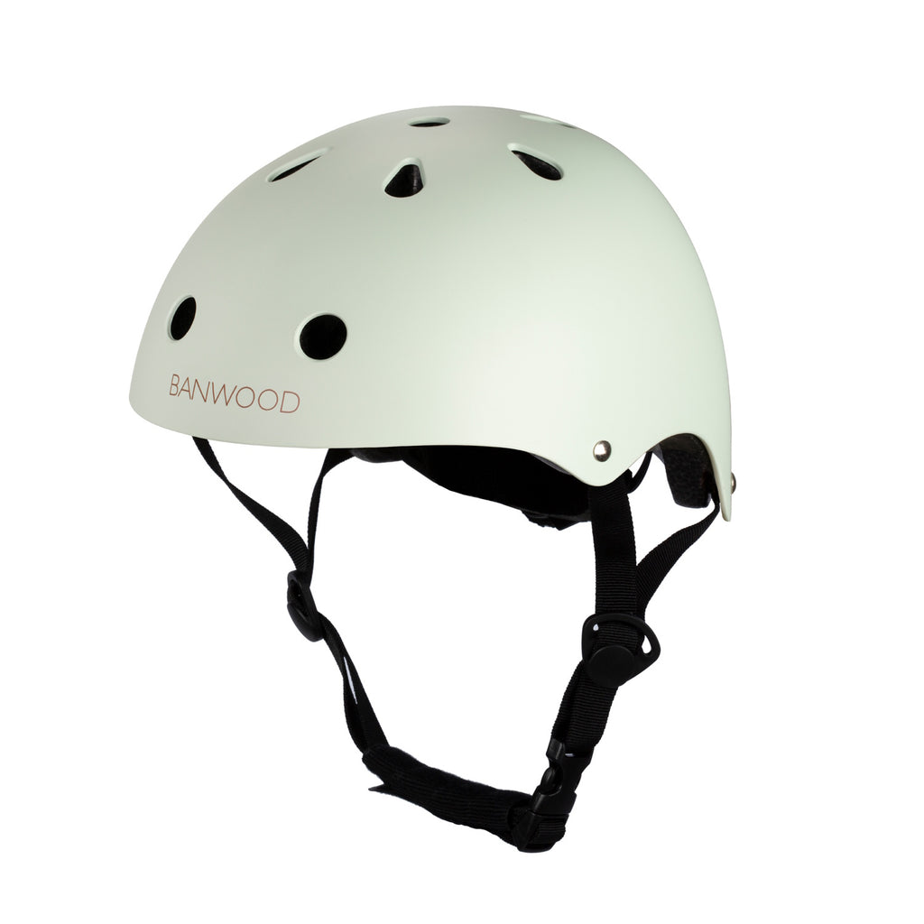 A vintage-inspired kids' bike helmet in a pale mint green shade, designed with ventilation, adjustable straps, and a secure fit for safety and comfort.