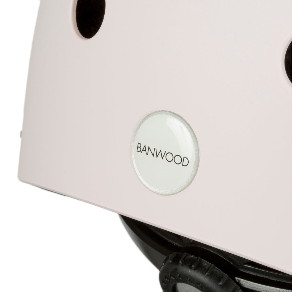 A sleek and safe children’s bike helmet in a pink finish, featuring ventilation holes, an adjustable fit system, and a secure chin strap.
