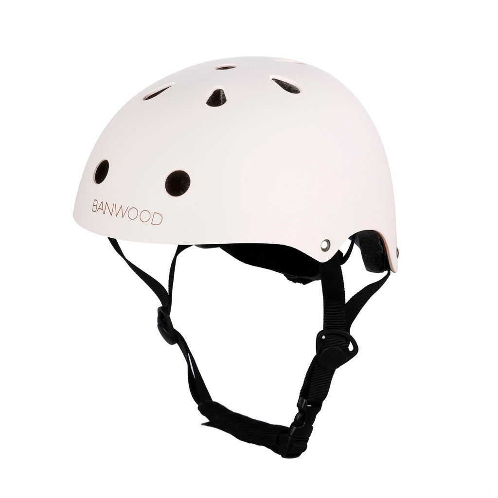 A sleek and safe children’s bike helmet in a pink finish, featuring ventilation holes, an adjustable fit system, and a secure chin strap.