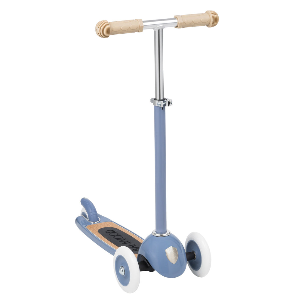 Children's scooter with three white wheels, a blue frame, and beige handles. It features a retro design with a sleek metal handlebar and wooden deck.