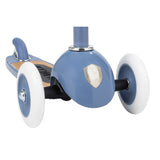 Banwood scooter blue wheel close-up showing three white wheels, blue hub with silver shield logo and wooden deck.