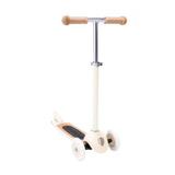 A stylish vintage-style kids' scooter in a soft cream color, featuring three wheels for stability and adjustable handlebar.