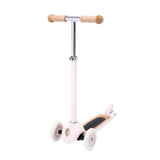 A charming retro-style kids' scooter in pastel pink, featuring three wheels for balance and adjustable handlebar.